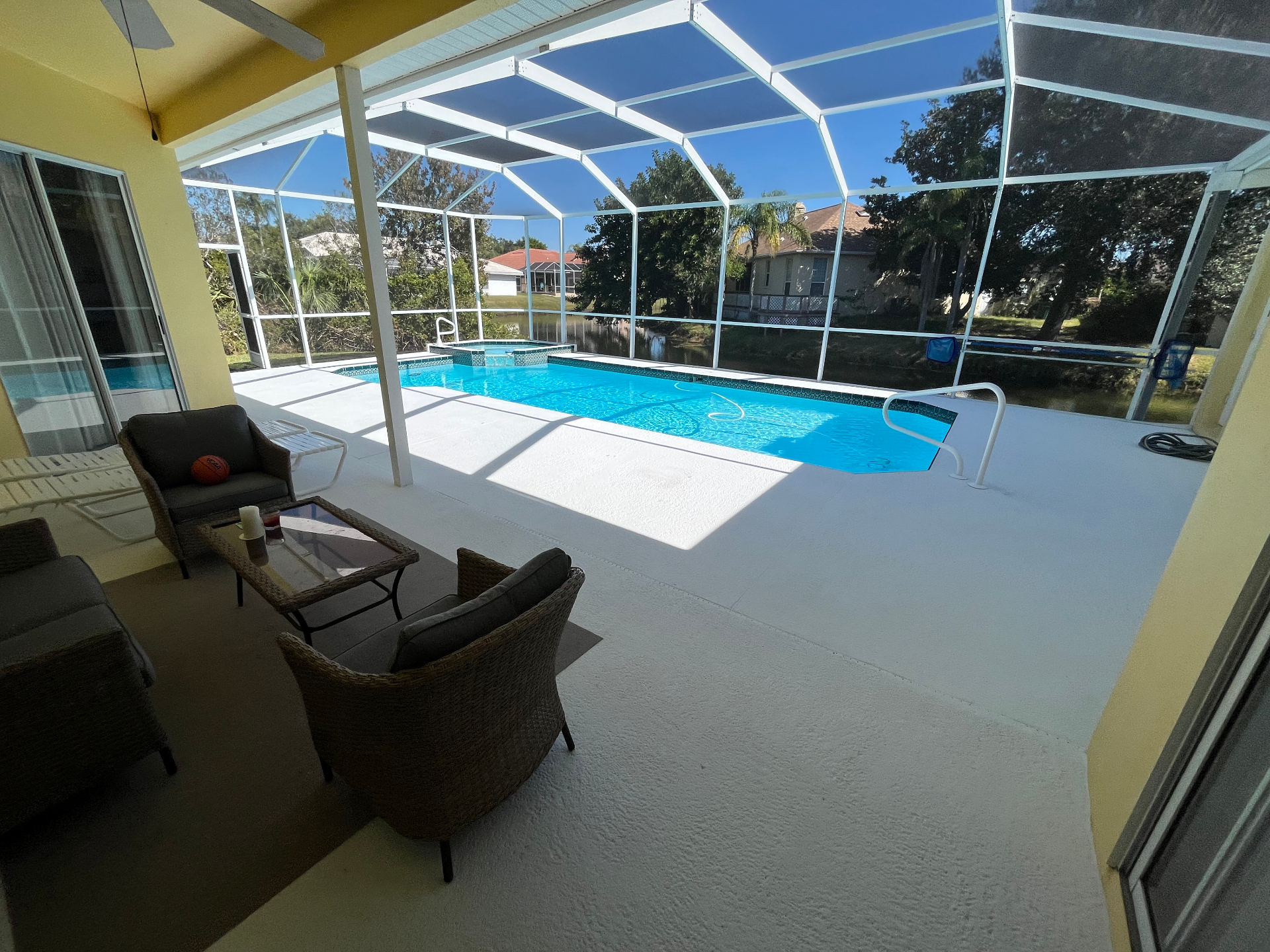 Finished pool deck with clean restored surface and seating area